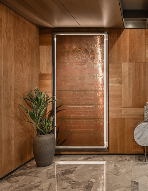 Copper cladding/ carved mantra in temple room